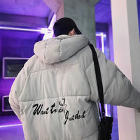 Back view of black Men's Winter Puffer Jacket with yellow graphic text, hooded and insulated for trendy and warm outerwear.