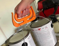 Close-up of MAMMOTH GRIP Heavy Duty Carrier lifting two large paint cans, emphasizing its durable build and comfort grip.