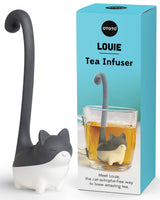 Cute Tea Infuser by OTOTO shaped like a cat named Louie, designed for loose leaf tea with a long tail handle, shown beside its packaging.