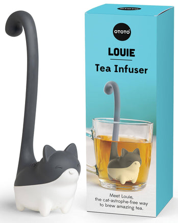Cute Tea Infuser by OTOTO shaped like a cat named Louie, designed for loose leaf tea with a long tail handle, shown beside its packaging.