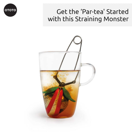 OTOTO Cute Tea Infuser steeping in a glass mug. A fun and monster-themed tea accessory for flavorful loose leaf tea brewing.