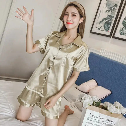 Women Silk Satin Pajamas in a luxurious gold color featuring a short-sleeve button-up top and matching shorts, perfect for elegant sleepwear.