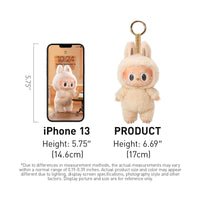 POP MART The Monsters Tasty Macarons Blind Box figure in fluffy bunny costume shown next to iPhone 13 for size comparison, 6.69 inches tall.