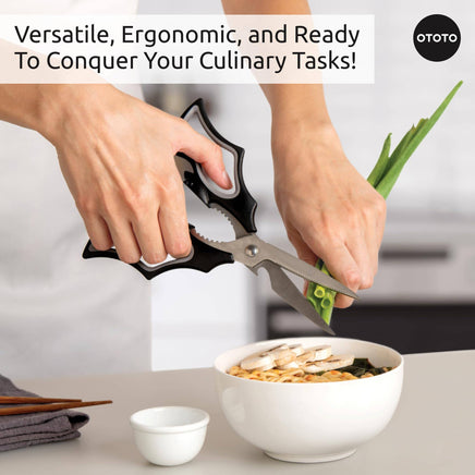 OTOTO Elizabat Halloween Bat Kitchen Scissors cutting green onions over a bowl. Ergonomic bat-wing handles add spooky charm to kitchen prep.