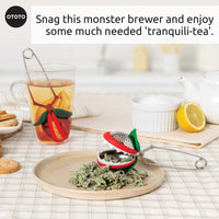 OTOTO Tea Trap infuser with dried herbs and tea cup. A playful and practical tea accessory for brewing loose leaf tea.