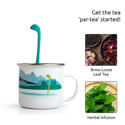 Cute Tea Infuser by OTOTO shaped like a sea monster in a white mug with mountain design, ideal for brewing loose leaf or herbal tea.