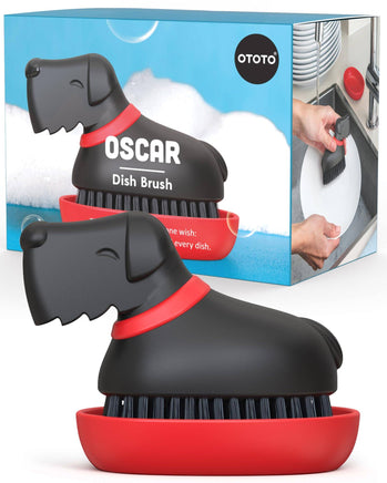 Oscar Dish Brush by Ototo shaped like a black dog with red collar, includes a red tray, perfect for fun and functional dish cleaning.