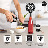 Halloween Bat Kitchen Scissors - OTOTO Elizabat Shears with bat-wing handles cutting green onions over a bowl in a modern kitchen setting.