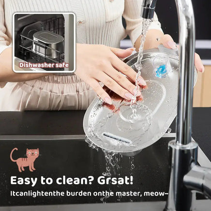 Stainless steel cat water dispenser being rinsed under a faucet, showcasing its dishwasher-safe and easy-to-clean design.