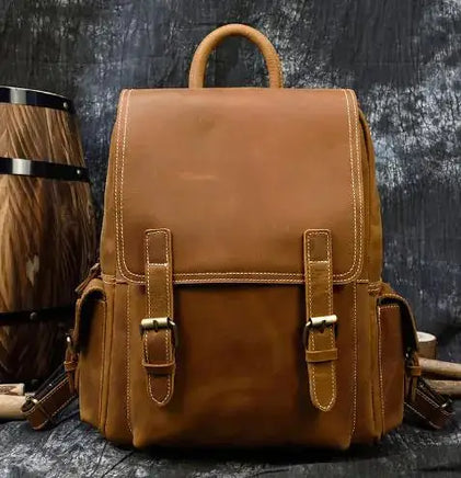 Light brown Crazy Horse leather men's retro backpack featuring buckle straps and a sturdy handle, perfect for casual or professional use.