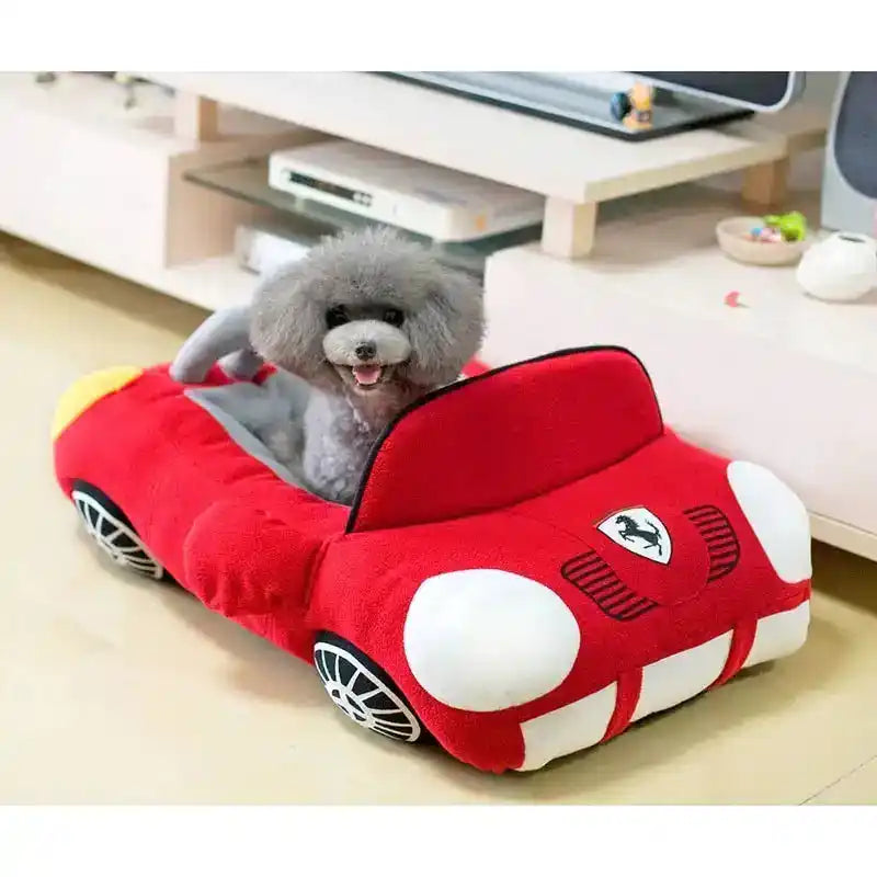 Car Pet Nest shaped like a red sports car with plush cushioning, providing comfort and security for small pets during travel or home use.