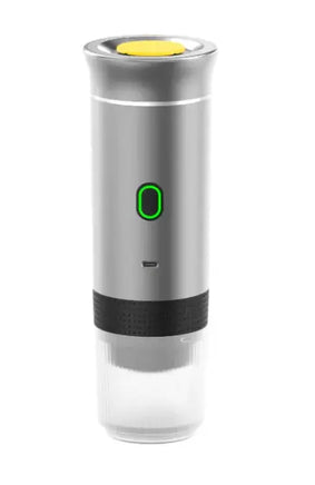Silver portable capsule coffee machine with a modern design, green power indicator, and detachable water tank for portable coffee brewing.