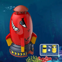 Red Rocket Launcher Toy with shark face design, featuring water spray functionality and faucet connection for outdoor play.