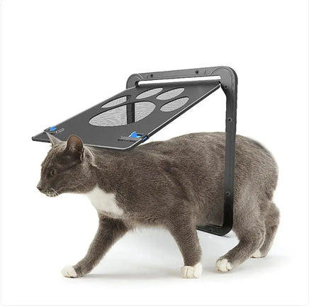 Gray cat exiting through the Pet-Safe Anti-Chew Screen Door with magnetic closure and paw design, perfect for secure pet access.