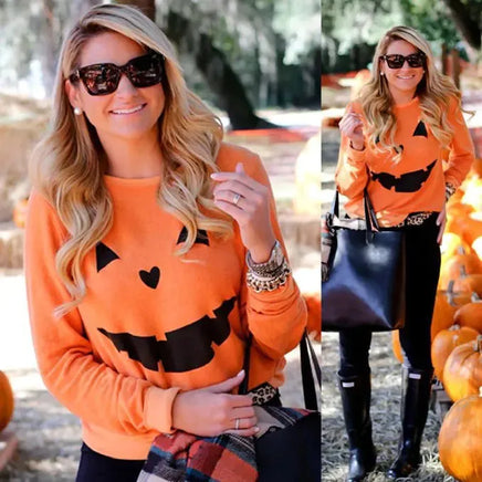 Woman at pumpkin patch wearing Halloween Pumpkin Sweatshirt - Perfect for Spooky Season, paired with boots and accessories for fall fashion.