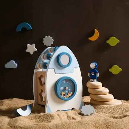 Educational rocket toy in a space-themed setup with an astronaut figure, inspiring creativity and imaginative storytelling.