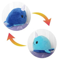 Blue narwhal double-sided plush toy with reversible sad and happy expressions. Soft and adorable from Shop Name.