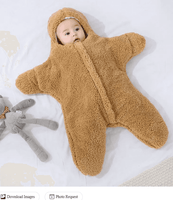 Baby in tan fleece hooded onesie with teddy bear on white bedding