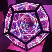 Top view of Infinite Dodecahedron Color Art Light with pink and purple LED lights forming a captivating geometric tunnel effect.