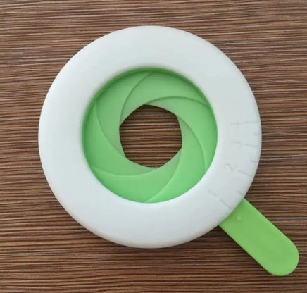 Close-up of a white and green noodle potentiometer pasta measurer with adjustable settings. A must-have kitchen tool for pasta lovers.