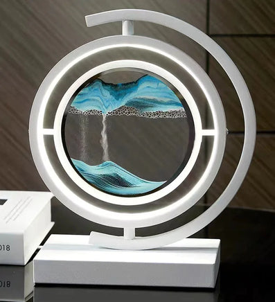 3D Quicksand Table Lamp with mesmerizing blue and black quicksand art encased in a circular frame, illuminated by LED lights on a sleek white base.