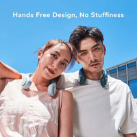 Dark green Mini Bladeless Neck Fan Outdoor on a table, featuring a USB charging port and ergonomic shape for portable, quiet cooling.