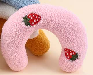 Pink U-shaped pet pillow with strawberry design