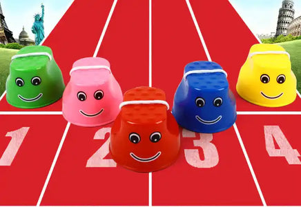 Colorful children's outdoor stilts in green, pink, red, blue, and yellow on a race track, promoting fun balance training and motor skills.