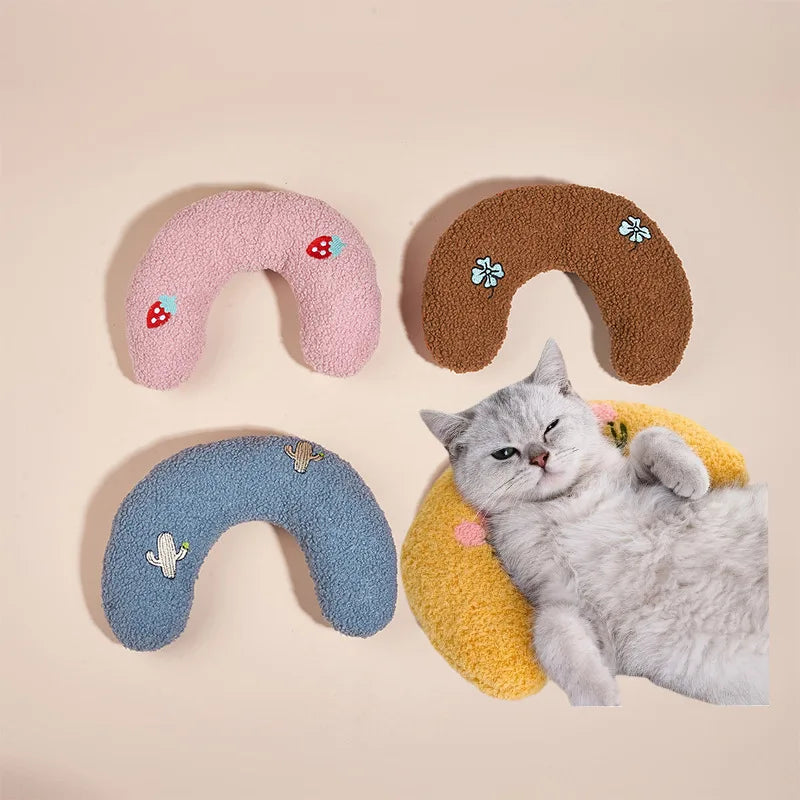 Set of colorful U-shaped pet pillows with cat