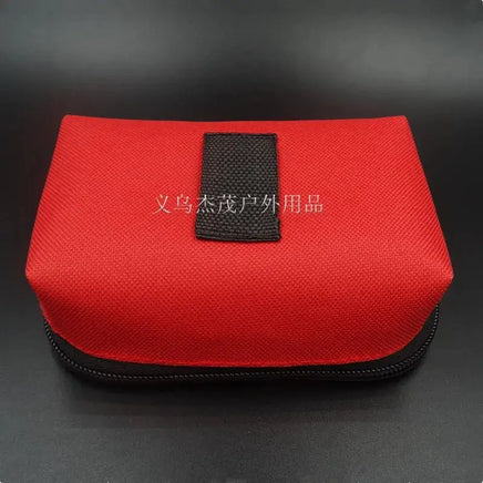 Red emergency survival bag with a black strap, suitable for storing essential tools and first aid items for emergency readiness.