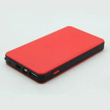 Red multifunctional portable emergency power bank featuring USB ports and compact design for charging and jump-starting.