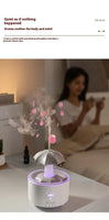 White Raindrop Aromatherapy Humidifier in a bedroom setting, releasing mist with soft lighting for a relaxing ambiance.