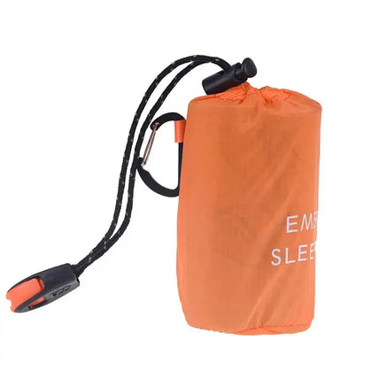 Side view of the orange waterproof reusable emergency sleeping bag with a black drawstring and carabiner clip for easy carrying.