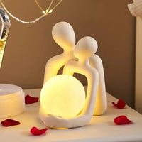 Minimalist Nordic couple statue with warm yellow light, ideal for home decor and romantic ambiance.