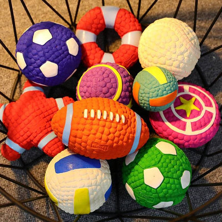 Assorted squeaky dog toys in various shapes and colors, including balls and stars, displayed in a basket. Great pet supply from Shop Name.