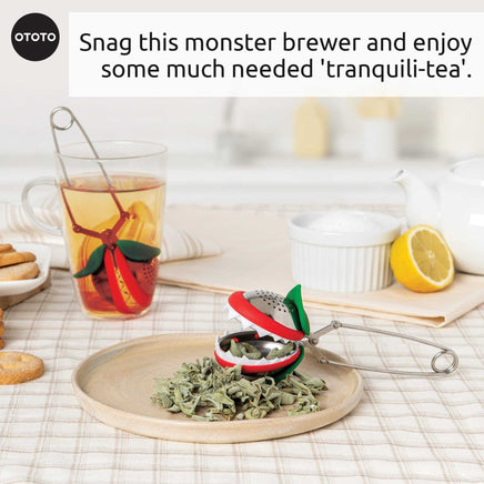 OTOTO Tea Trap infuser with dried herbs and tea cup. A playful and practical tea accessory for brewing loose leaf tea.