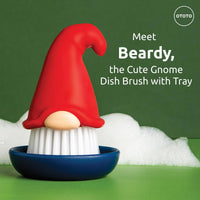 Meet Beardy, the gnome-shaped dish brush with tray by Ototo, surrounded by soap suds, adding charm to your dishwashing routine.
