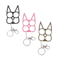 Portable Cute Cat Multifunction Outdoor Gadgets Keychains in black, pink, and gold arranged diagonally with key rings and clips.