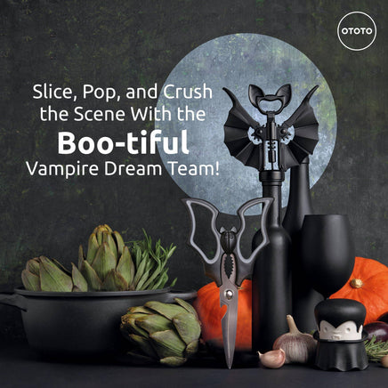 Halloween Bat Kitchen Scissors - OTOTO Elizabat Shears with bat-wing handles, displayed among pumpkins and kitchen tools for spooky decor appeal.