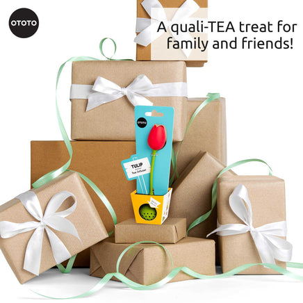 Cute Tea Infuser by OTOTO shaped like a red tulip, displayed among gift-wrapped boxes. Fun tea accessory perfect for loose leaf tea lovers.