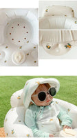 Close-up of inflatable baby chair with small fruit print