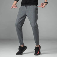 Crossfit Track Sweatpants in gray, featuring a slim-fit design with an elastic waistband and ankle cuffs, ideal for gym and sportswear.