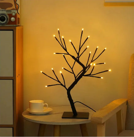 Minimalist tree lamp with warm white LED lights on black branches, perfect for modern and cozy bedroom decor.