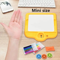 Compact Kids Mini Art Table Set showing a yellow drawing surface, markers, stencil discs, and an eraser for easy cleaning.