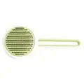 Green Automatic Hair Remover & Massage Comb for cats and dogs with a sleek design and ergonomic handle.