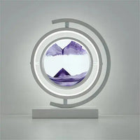 3D Quicksand Table Lamp with mesmerizing purple quicksand effects, circular design, and modern white base for artistic illumination.