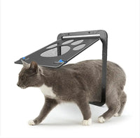 Pet-Safe Anti-Chew Screen Door for Secure Homes Magnetic shown with a gray cat walking through the paw-shaped flap, ideal for pet access.