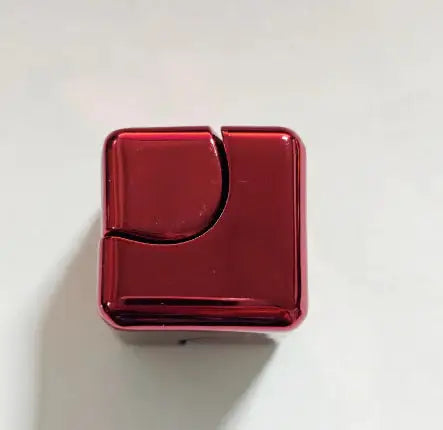 Glossy red metallic fidget spinner cube with a curved design, perfect for stress relief and focus enhancement.
