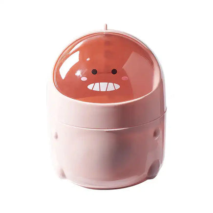 Pink dinosaur desktop trash can with a fun cartoon face, ideal for home office waste management and tidy desk organization.