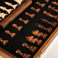 Close-up of wooden chess pieces in a folding storage box with black velvet lining, part of the Large Children's Wooden Folding Chess Set.